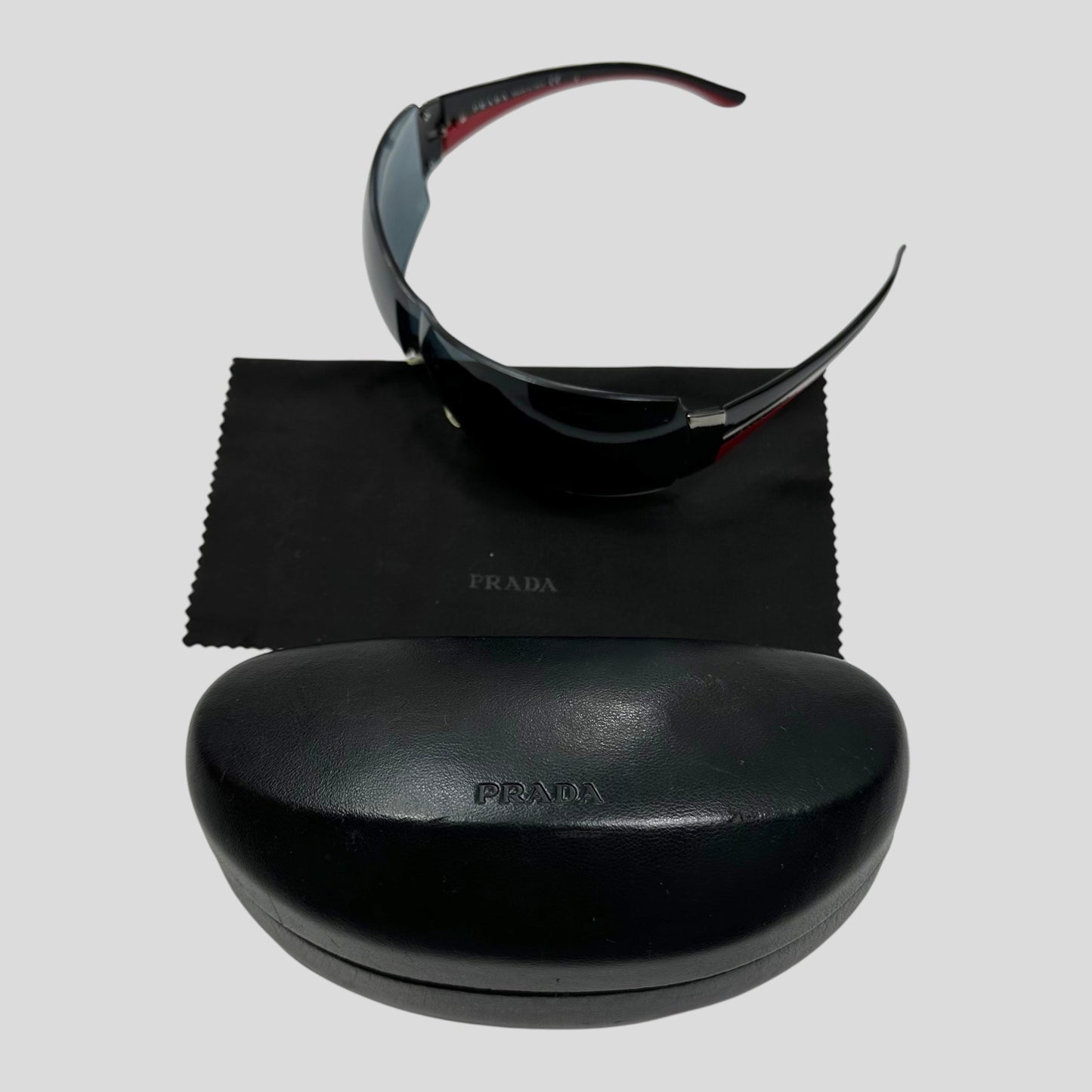 Prada Wraparound Frameless Shield Sunglasses